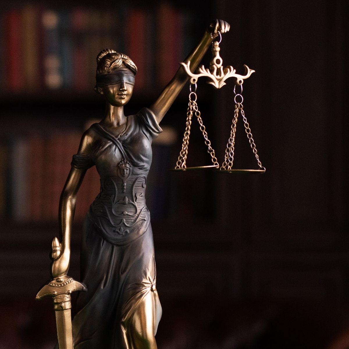 Bronze statue of Lady Justice holding the scales